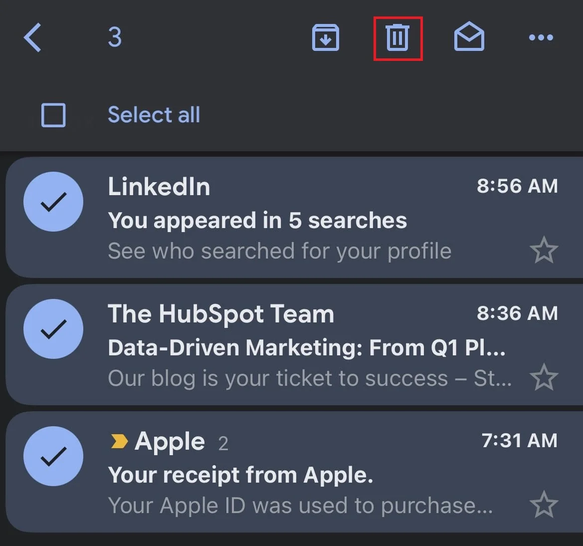 Gmail mobile inbox with three messages selected and the Delete icon highlighted.